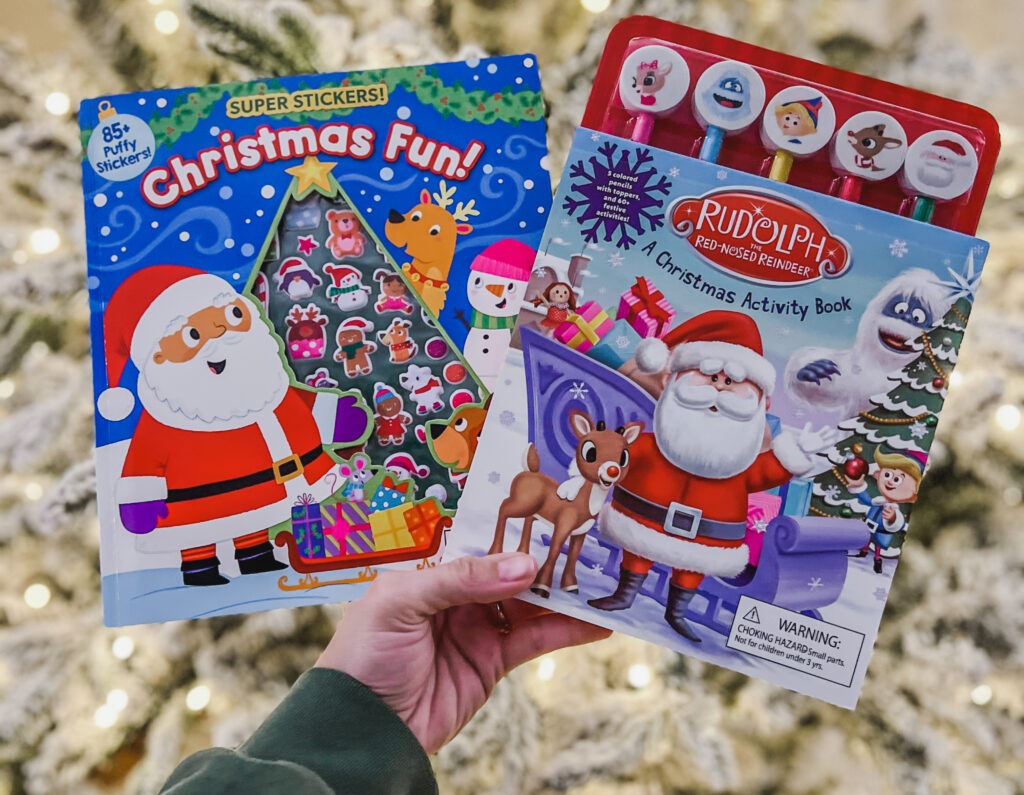Super Puffy Stickers: Christmas Fun and Rudolph the Red-Nosed Reindeer Activity Book against Christmas tree